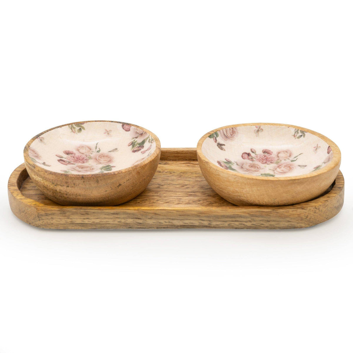 Two round mango wood bowls with a hand-painted cream interior featuring a delicate pink rose and botanical floral design, sitting side by side on a matching rectangular mango wood serving tray, photographed on a white background