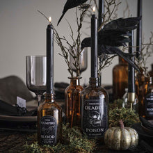 POISON BOTTLES WITH BLACK TAPER CANDLES